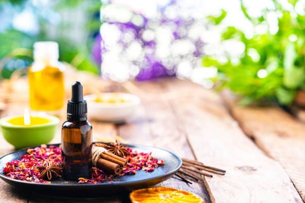istock Aromatherapy: essential oil bottle on wooden table. Copy space 1306657537