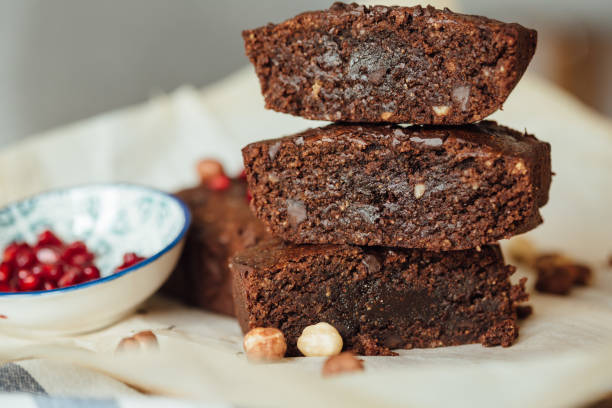 istock Chocolate brownie with hazelnut. Side view close up. 1306657792