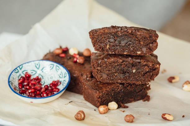 istock Chocolate brownie pastry with hazelnut. Side view close up. 1306657916