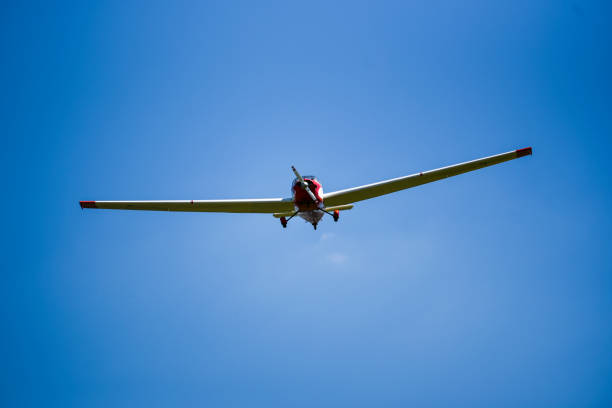 istock Small plane flying o na blue sky, sunny day. 1306658644