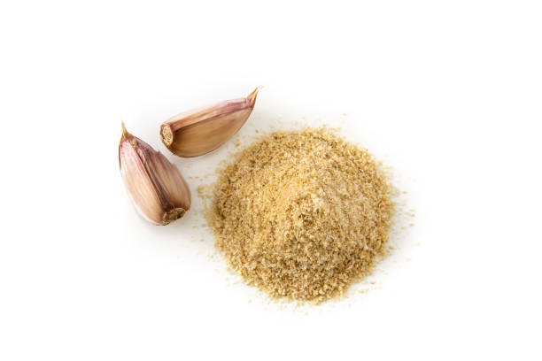 istock Garlic cloves and garlic powder 1306659119