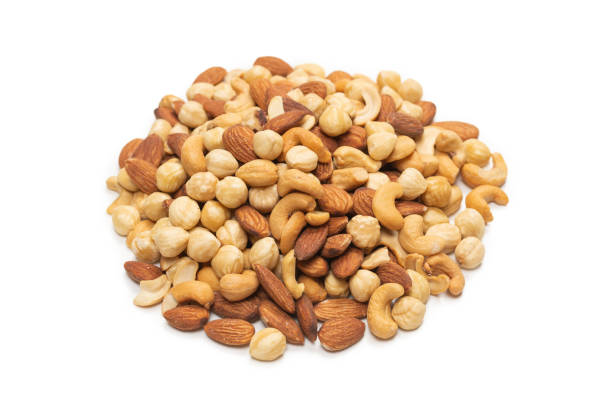istock Mix of nuts isolated on white background. Top view. 1306659247