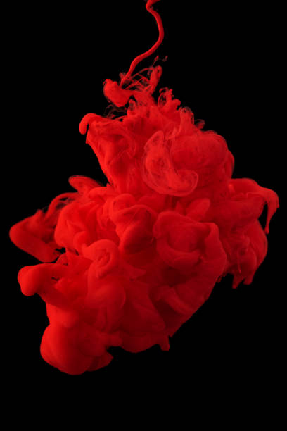istock acrylic ink in water form an abstract smoke pattern isolated on black background 1306659464