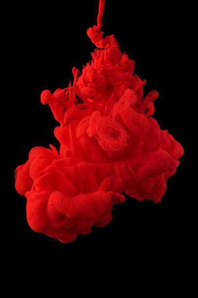 istock acrylic ink in water form an abstract smoke pattern isolated on black background 1306659513