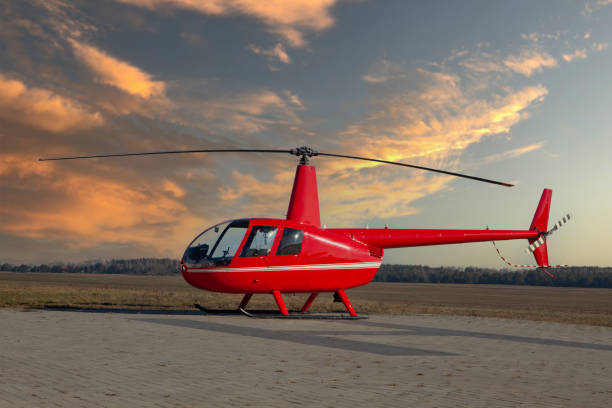 istock Little red helicopter at take-off site. 1306659561