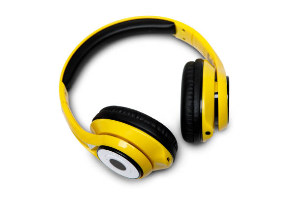 istock Yellow wireless headphones on white background. 1306660529