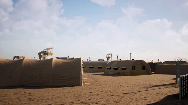 Camera passing through an army camp and training facility in the middle of the desert