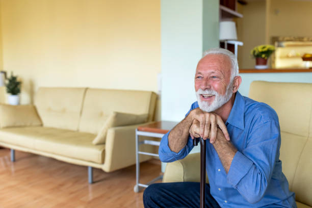 istock Lonely Senior Man is Sitting on Sofa at Home and Looking Confident. 1306661837