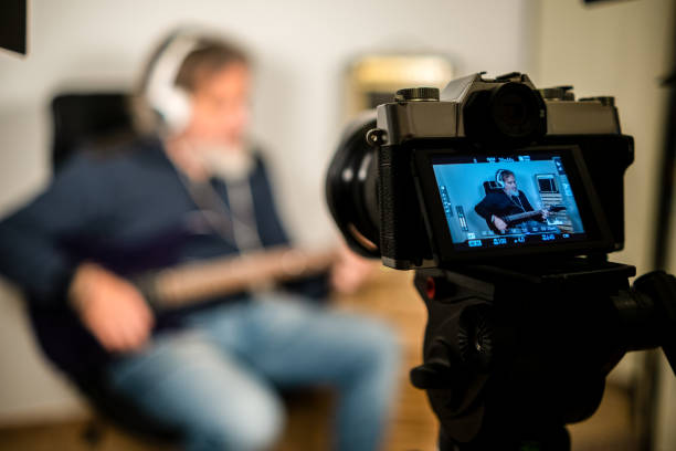 istock Man giving electric guitar lesson via streaming 1306661921