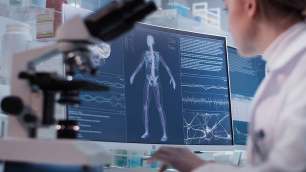 istock Female doctor working in laboratory. Studying human skeleton and DNA samples 1306664826