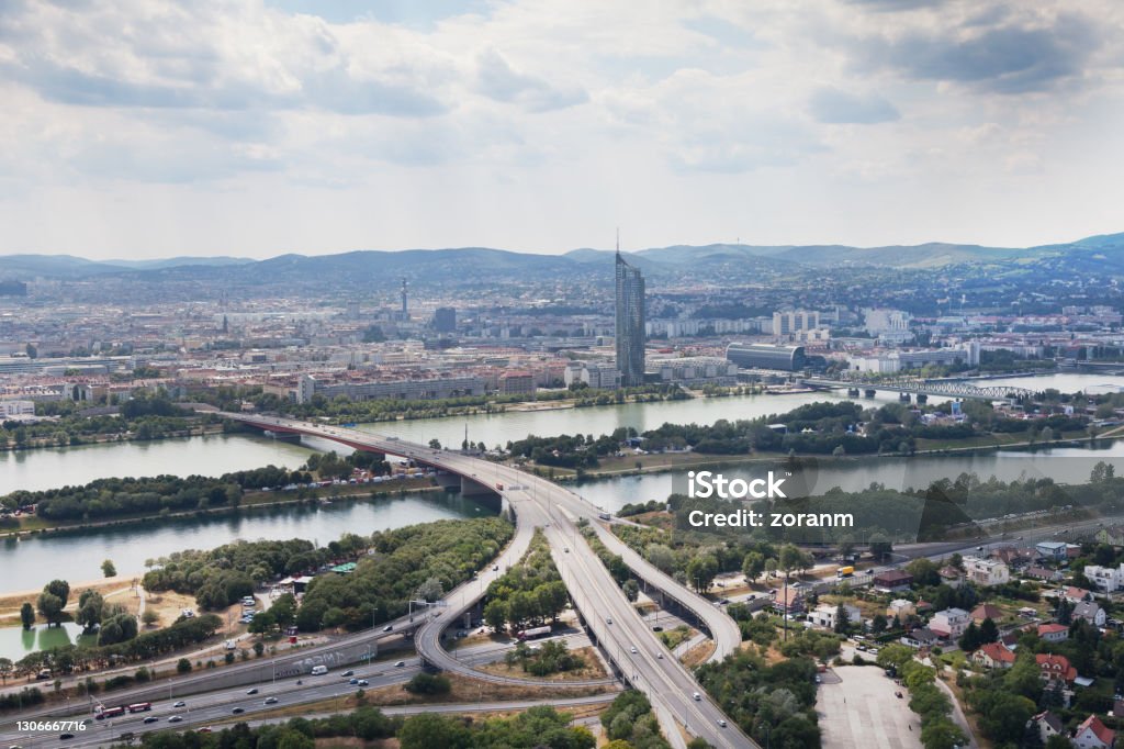 View on Vienna cityscape and highway junction on Danube River High angle view on the Danube River and the highway junction, green recreational area in the Donaupark Austria Stock Photo