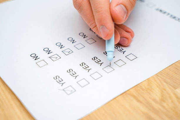 istock A survey form with yes or no answer options. Questionnaire on white paper, checkboxes ticked 1306670413