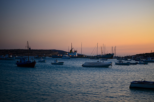 Koufonisi, Cyclades, Greece - August 16, 2013: Sunset in Koufonisi island port