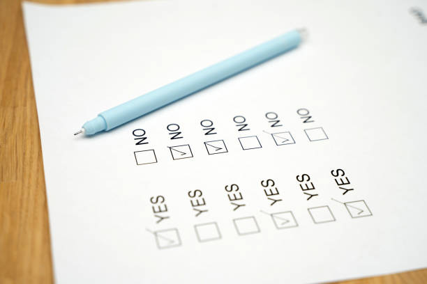 istock A survey form with yes or no answer options. Questionnaire on white paper, checkboxes ticked 1306670841