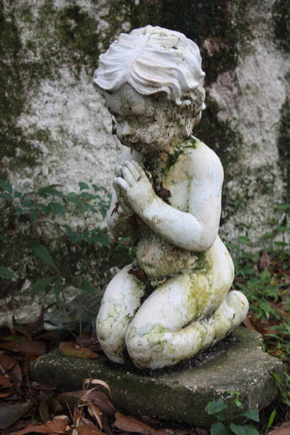 istock Praying Girl 1306671715