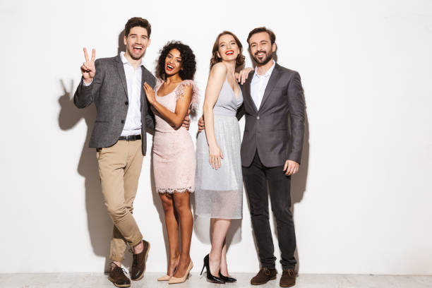 istock Group of happy well dressed multiracial people standing 1306674080
