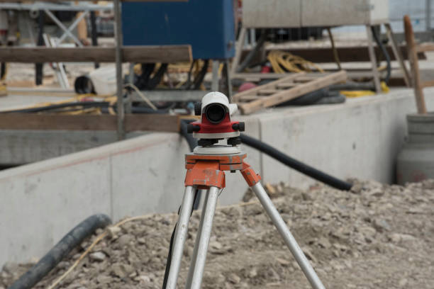 istock surveying by a land surveyor in geodesy 1306674402