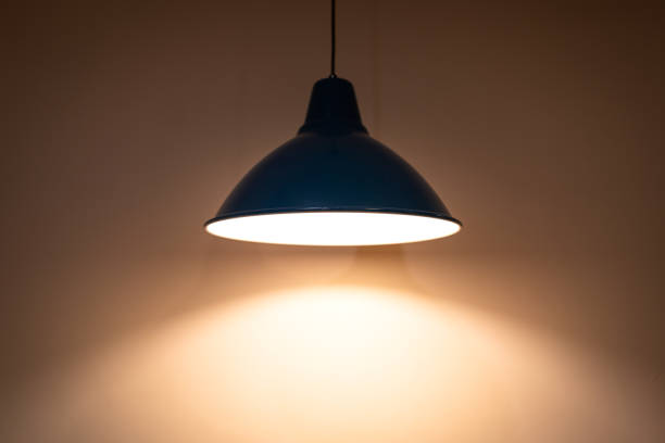istock Classic ceiling electric lamp glowing with warm light. 1306675662