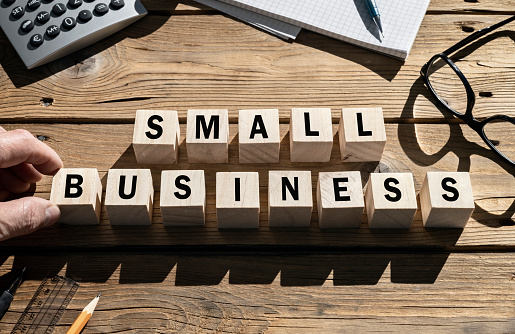 Small Business word on wooden blocks SME and entrepreneur startup businesses concept