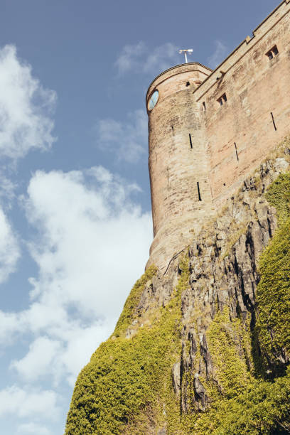 bamburgh castle exterior view on a sunny day in northumberland england - bamburgh bamburgh castle sand dune history imagens e fotografias de stock