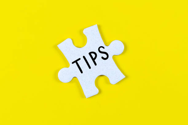 istock Tips text on jigsaw piece - business concept 1306680730