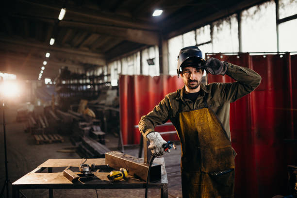 istock Welder working in a factory 1306680818