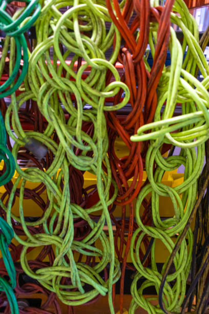 istock Electric Power Cables hanging on factory shelving 1306680875