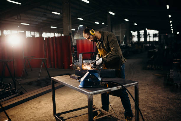 istock Welder working in a factory 1306681562
