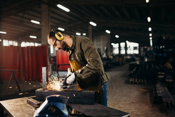 istock Welder working in a factory 1306681601