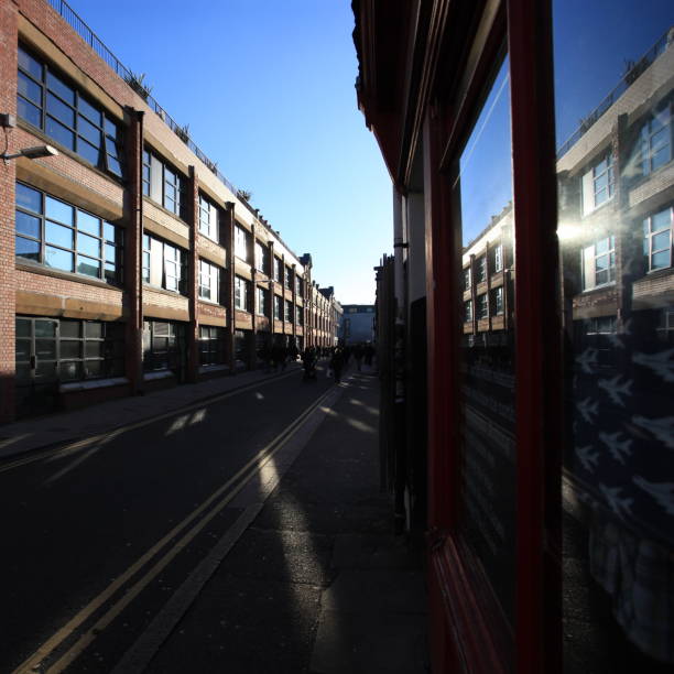 istock industrial building facade against a bleu sky reflected in windows of building 1306681663