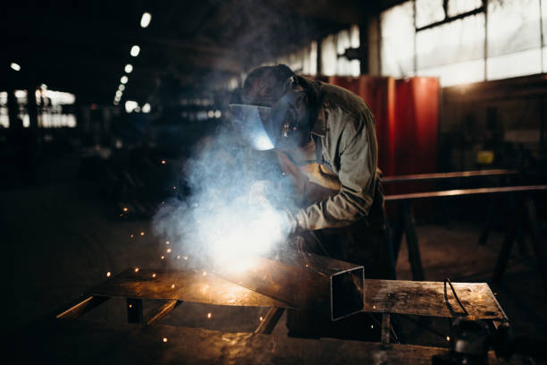 istock Welder working in a factory 1306681733