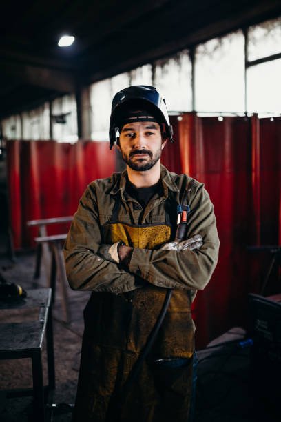 istock Welder working in a factory 1306681751