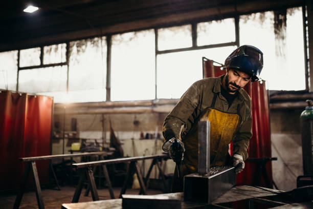 istock Welder working in a factory 1306681772