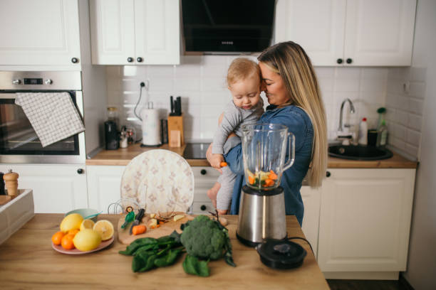 istock young mother is feeding her baby 1306681912