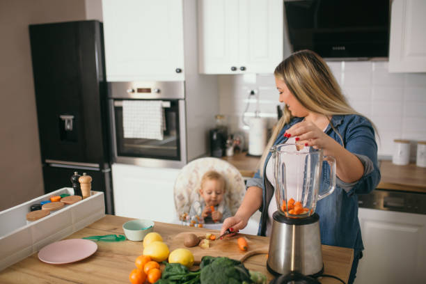istock young mother is feeding her baby 1306681997