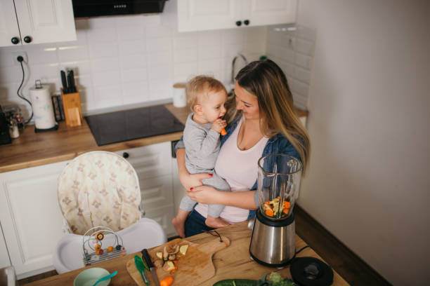 istock young mother is feeding her baby 1306682284