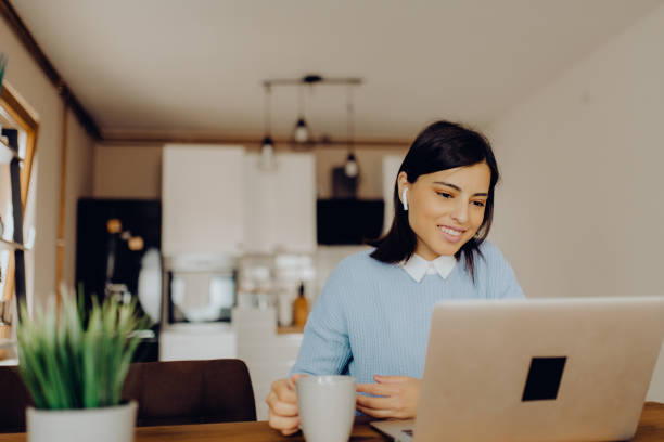 istock young woman having a video call with her friends 1306684577