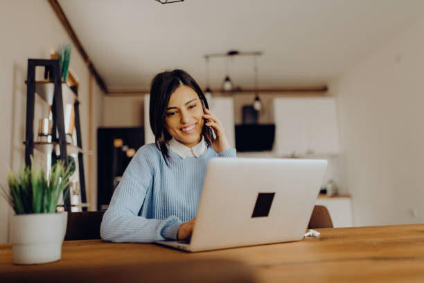 istock young woman having a video call with her friends 1306684672