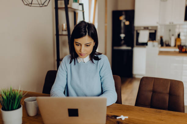 istock young woman having a video call with her friends 1306684681