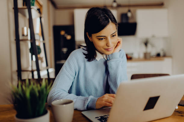 istock young woman having a video call with her friends 1306684739