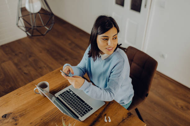 istock young woman having a video call with her friends 1306684811