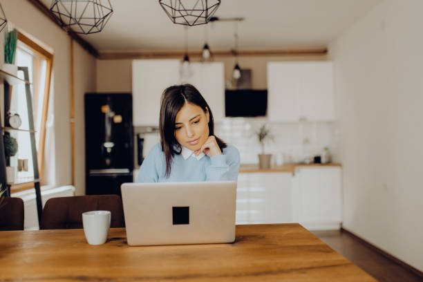 istock young woman having a video call with her friends 1306685604