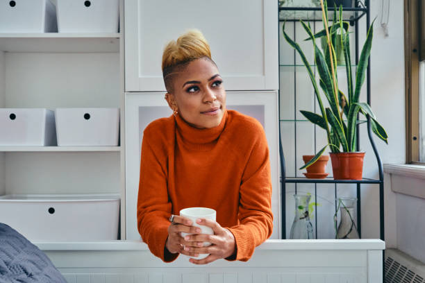 istock Happy Female Hipster Having Coffee At Home 1306687239