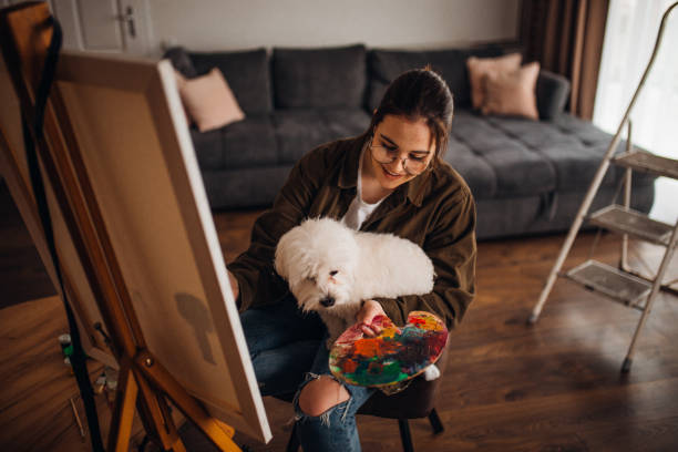 istock Girl painting on canvas 1306687540