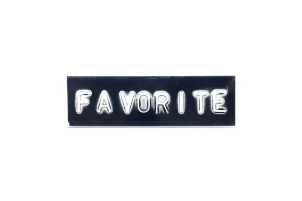 Photo of Embossed letter in word favorite on black banner with white background