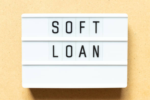 istock Lightbox with word soft loan on wood background 1306688189
