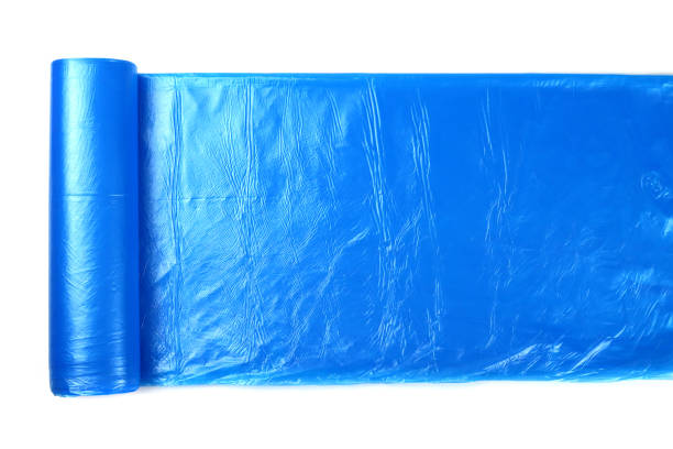 istock Roll of garbage bags isolated on white 1306696092