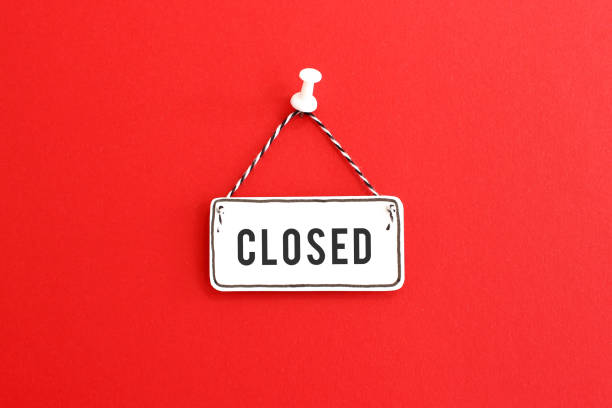 Handmade Closed sign on pin Handmade signboard with Closed inscription and striped rope hanging on pin on bright red background shut up stock pictures, royalty-free photos & images