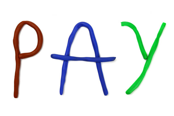 istock word pay, made of colored plasticine. Isolated on white 1306696199