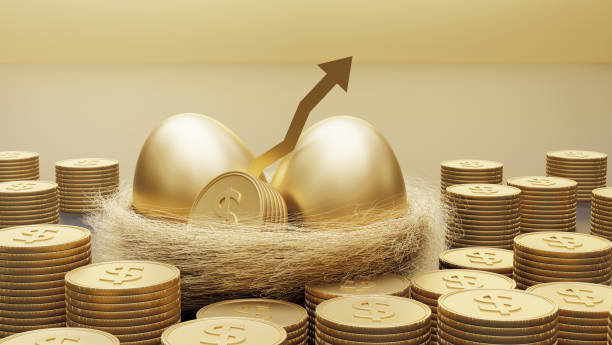 Golden eggs. A symbol of making money and successful investment on green background Stock Photo - Alamy
